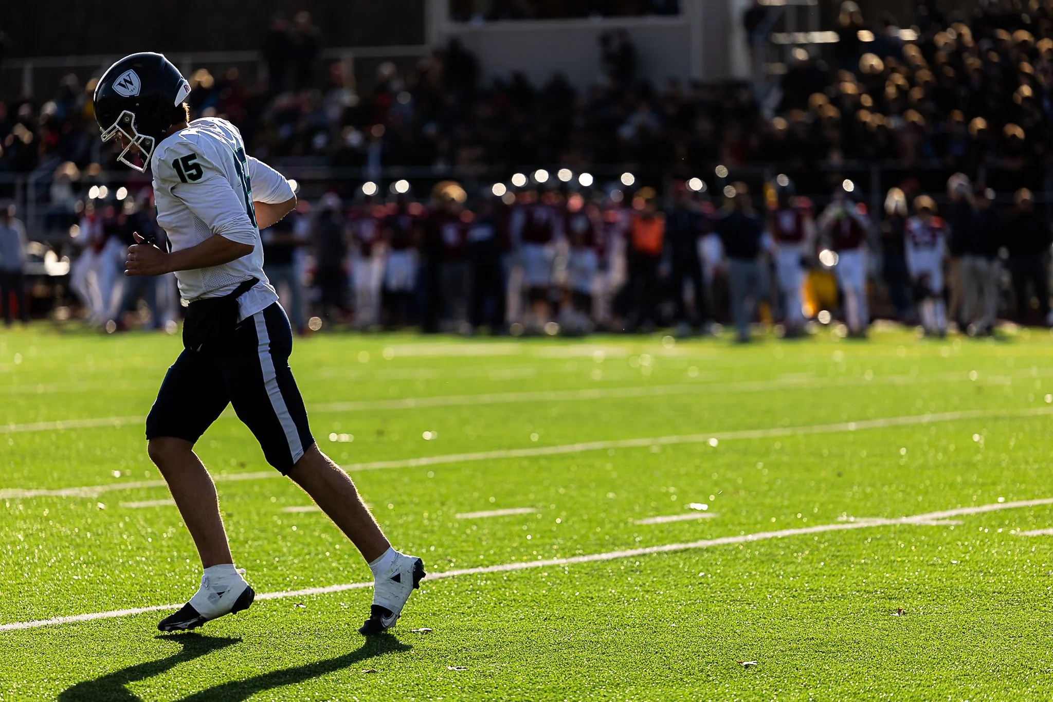 Williston quarterback Crew Colon runs off the field prior to a timeout during the NEPSAC Drew Gamere Bowl against Avon Old Farms in Avon, CT on November 15, 2025