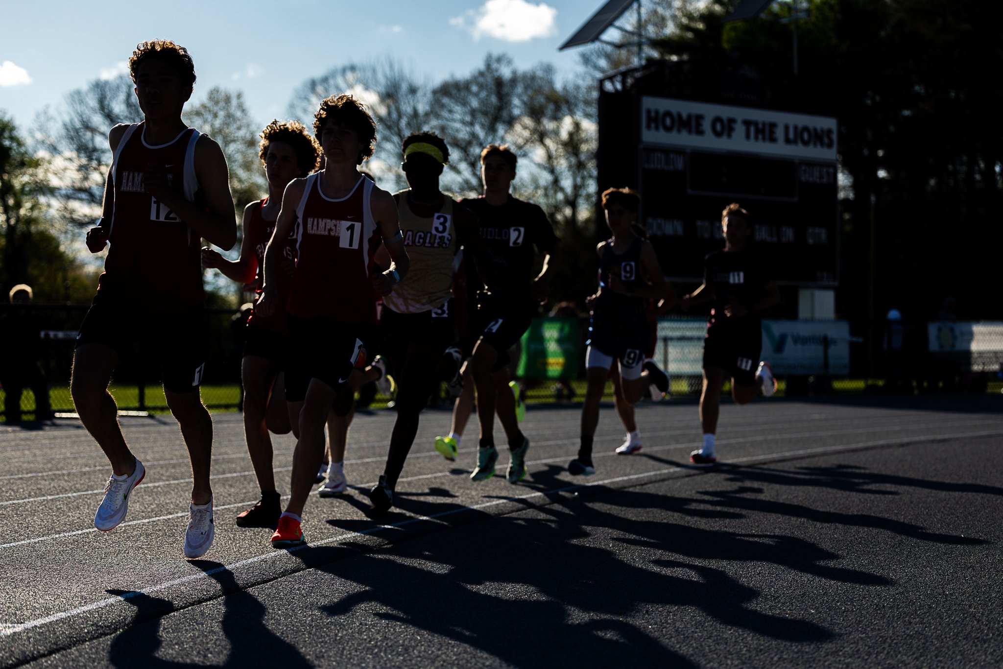 Runners compete beneath the harsh sunlight during the 1 mile race at the Lion Invitational on Friday, May 8, 2026 at Ludlow High School.