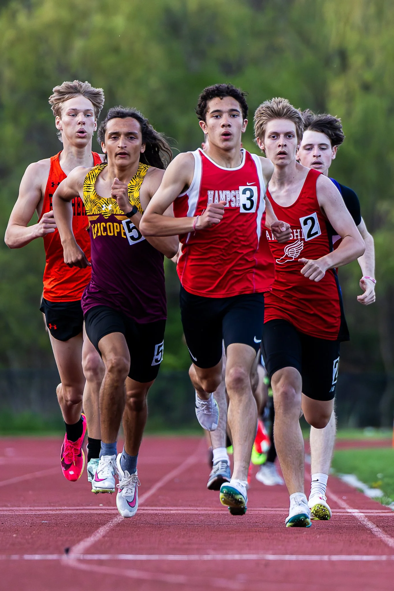 Owen Cubi (center) leads the pack during the 800m race at the 2025 Spartan Invitational at Hampshire Regional High School.