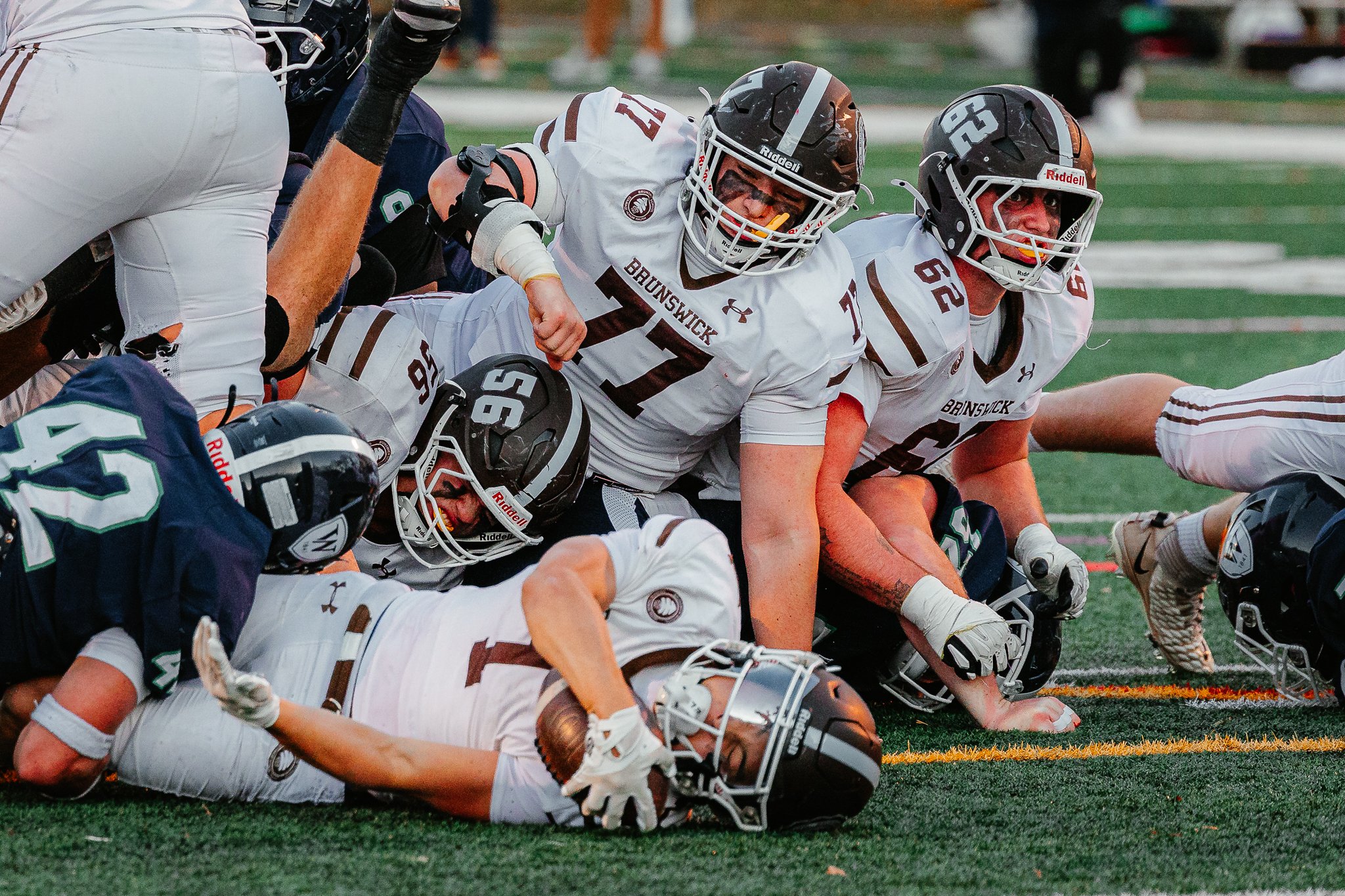 Boston Globe | Players fight through the whistle during Williston's 29-25 victory over visiting Brunswick on Nov. 8, 2025.