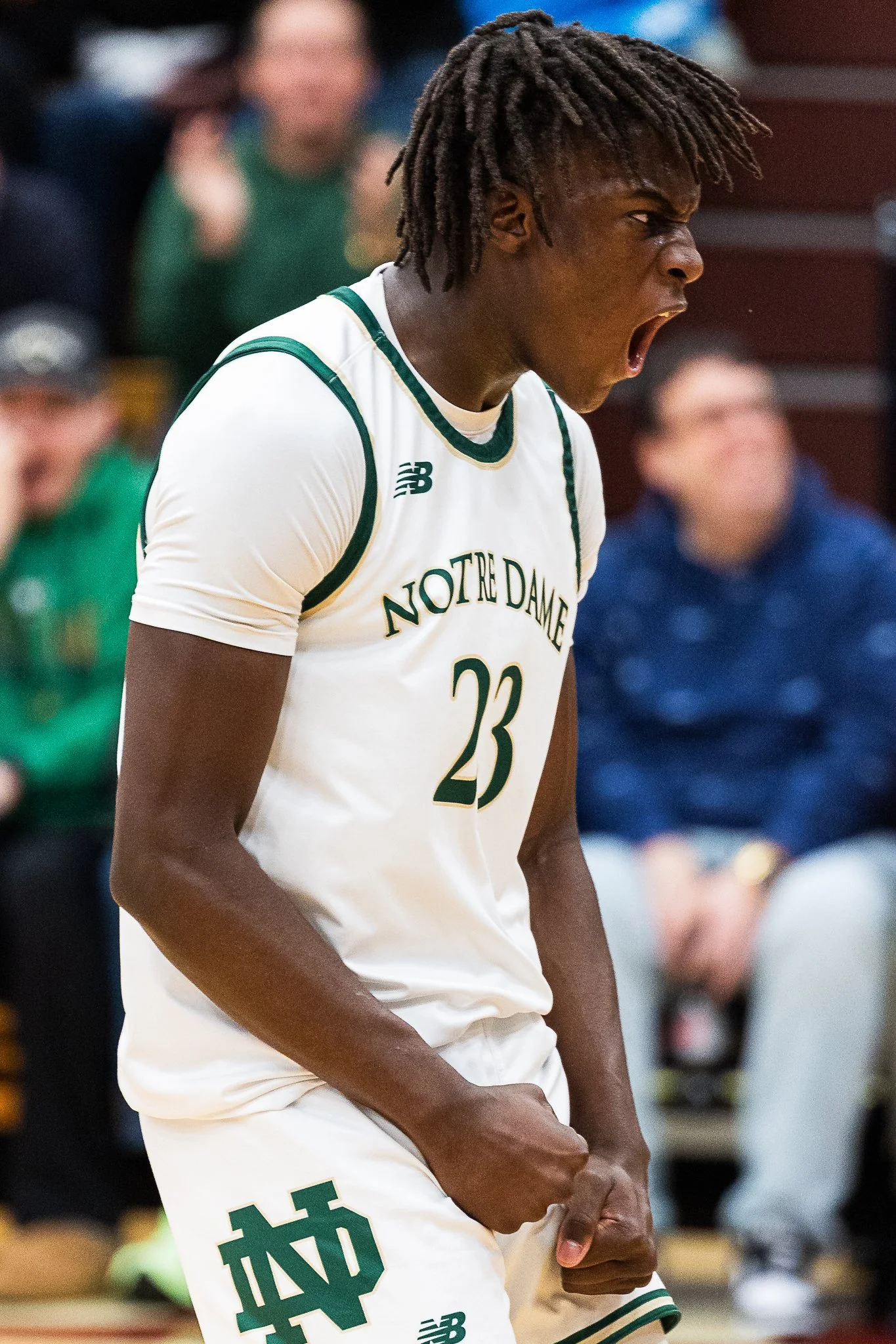 Notre Dame West Haven (CT) senior Abdou Toure (#22 SCNEXT 100) celebrates an explosive dunk during a game against Inglewood United at the PANINI Hoophall Classic in Springfield, MA on January 18, 2025.