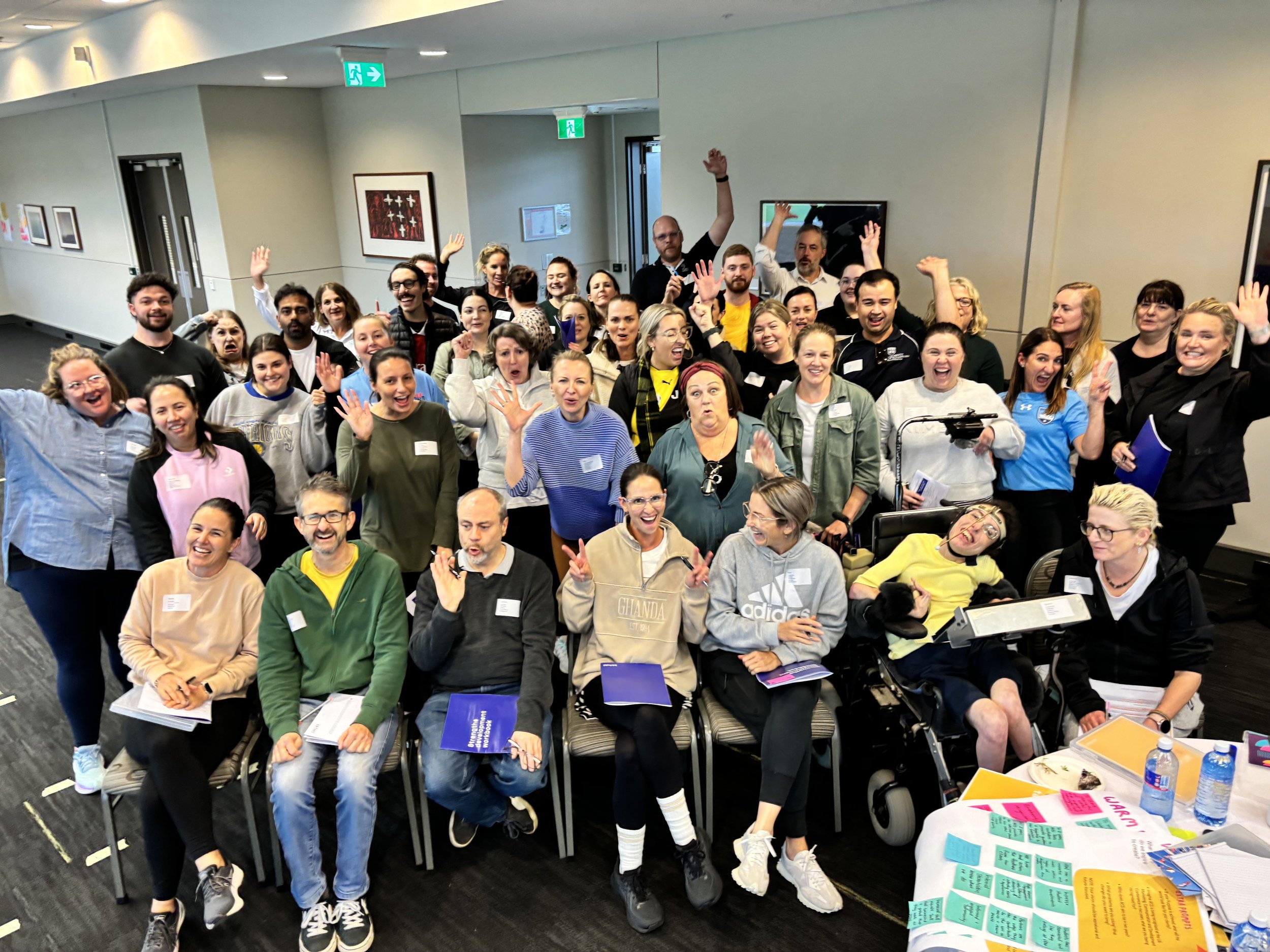 Large team completing a team development day