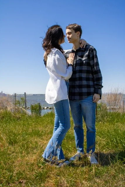 Engagement photo overlooking harbor at Fort Smallwood Park