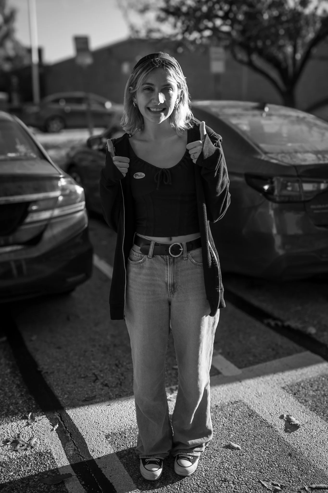 black and white photo of teen after first time voting in Maryland elections