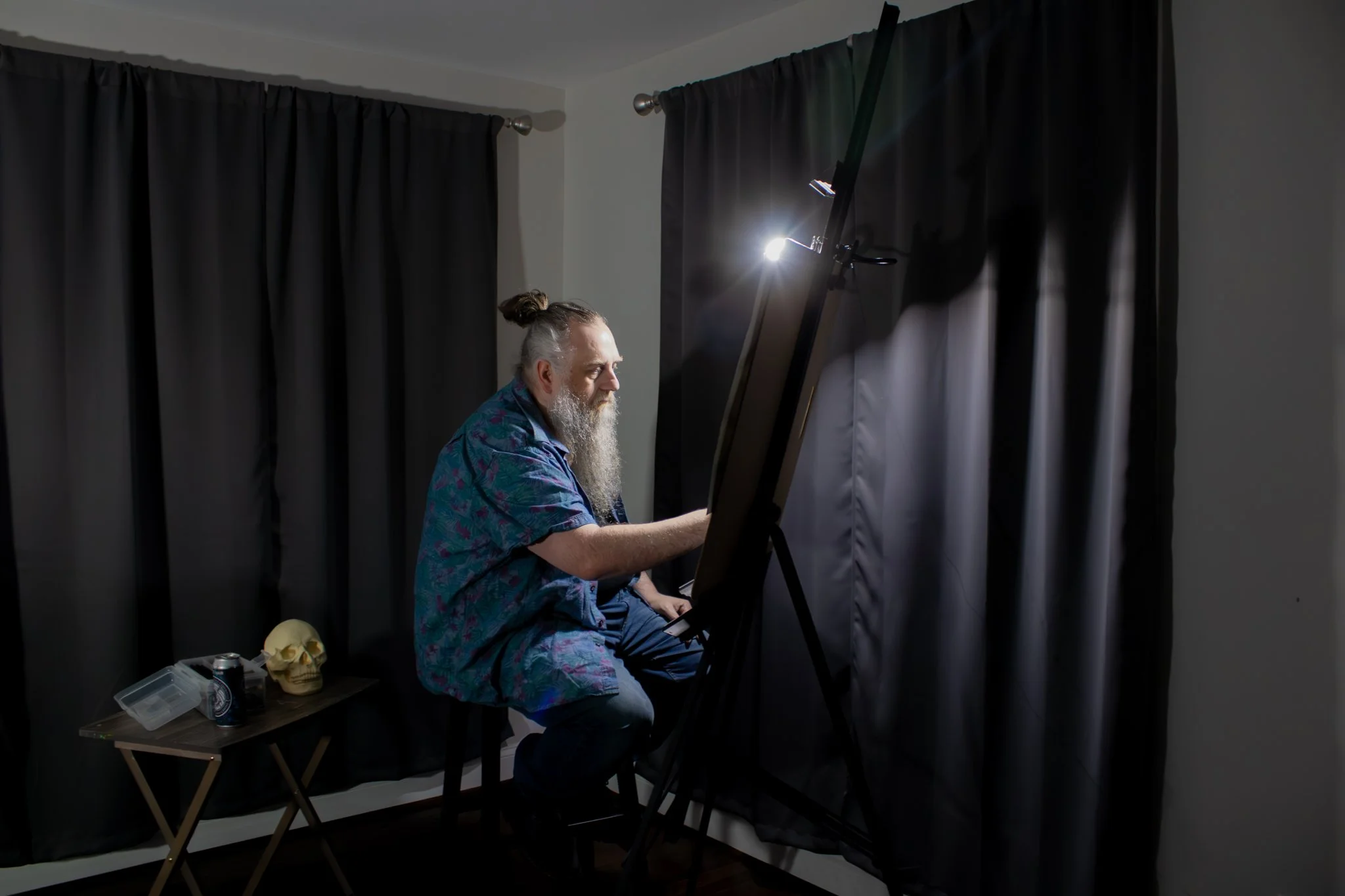 Man painting in art studio