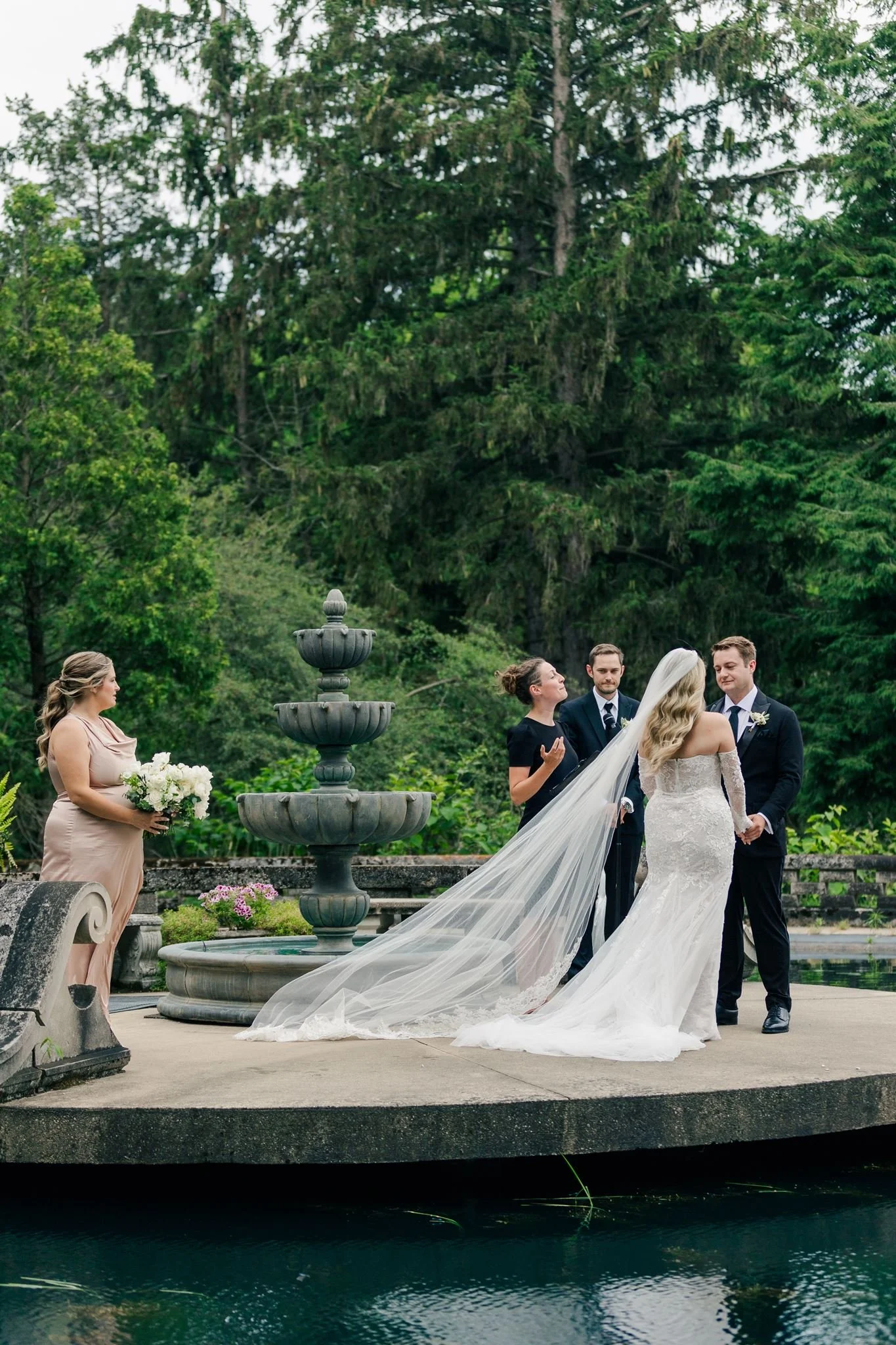 wedding-ceremony-in-front-of-fountain-felt-mansion.jpg