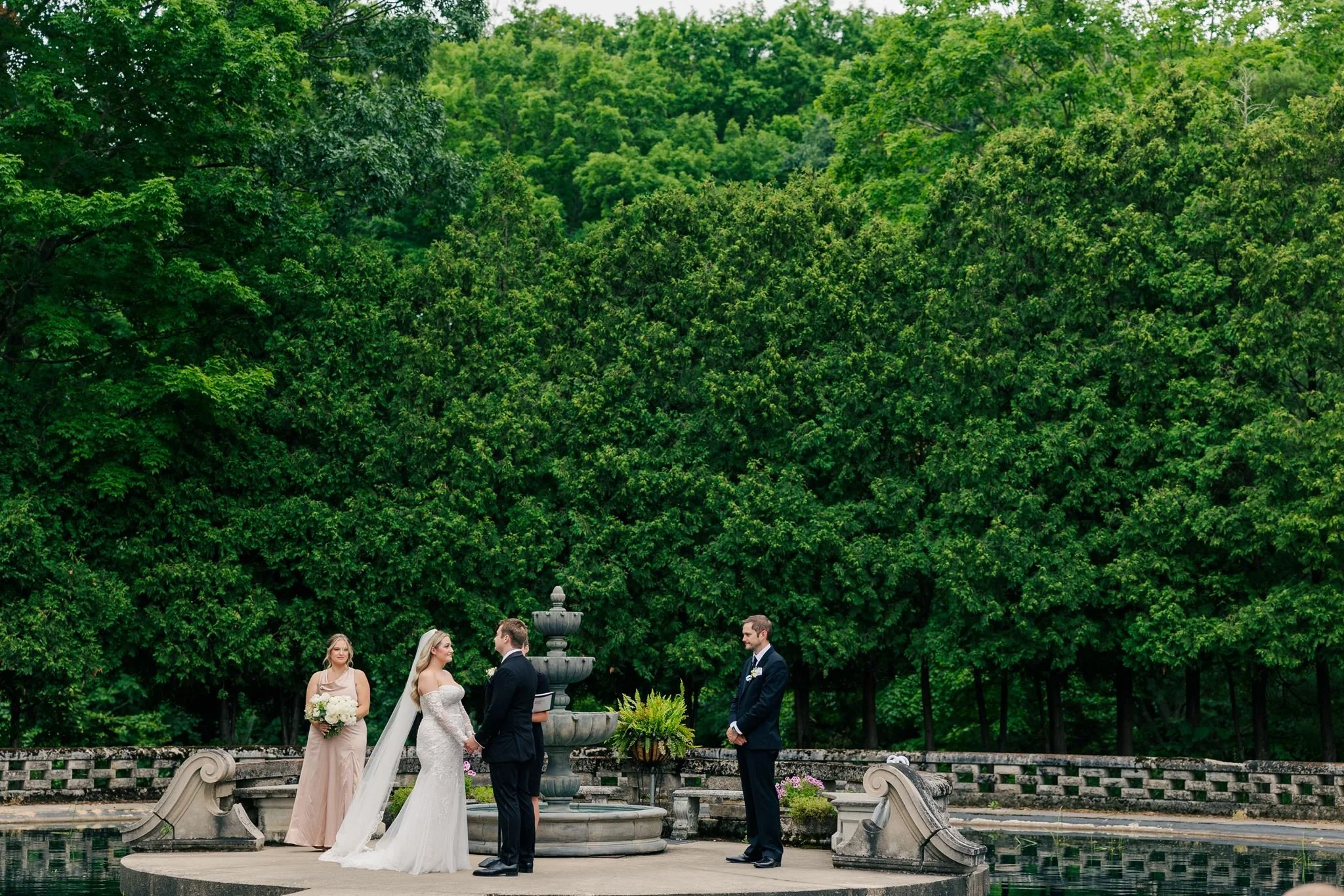wedding-ceremony-in-fountain-gardens-at-felt-mansion.jpg