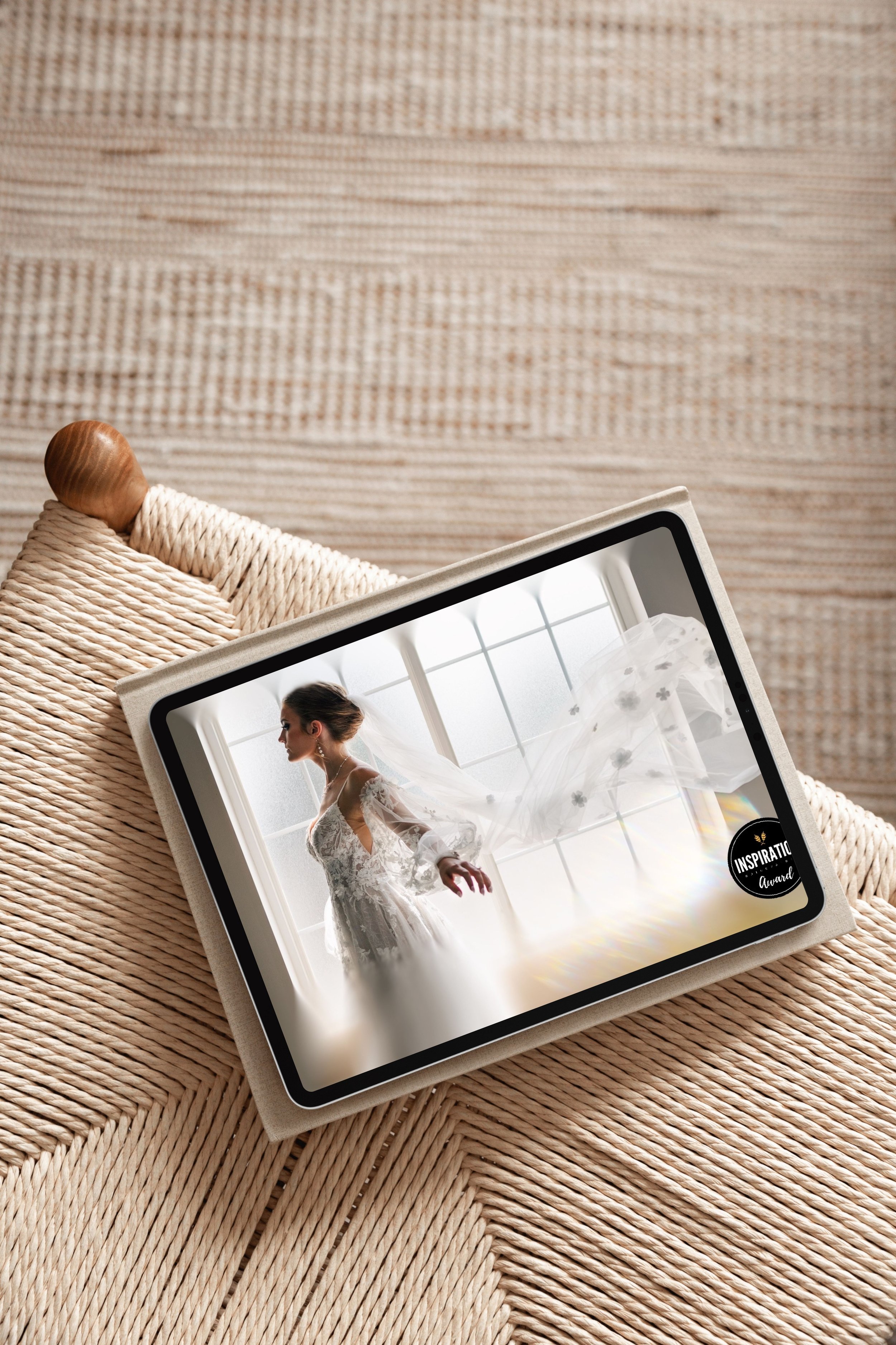 Digital photo frame displaying a profile of a bride in a wedding dress with a veil, standing by a large window, with an 'Inspiration Award' sticker on the corner.
