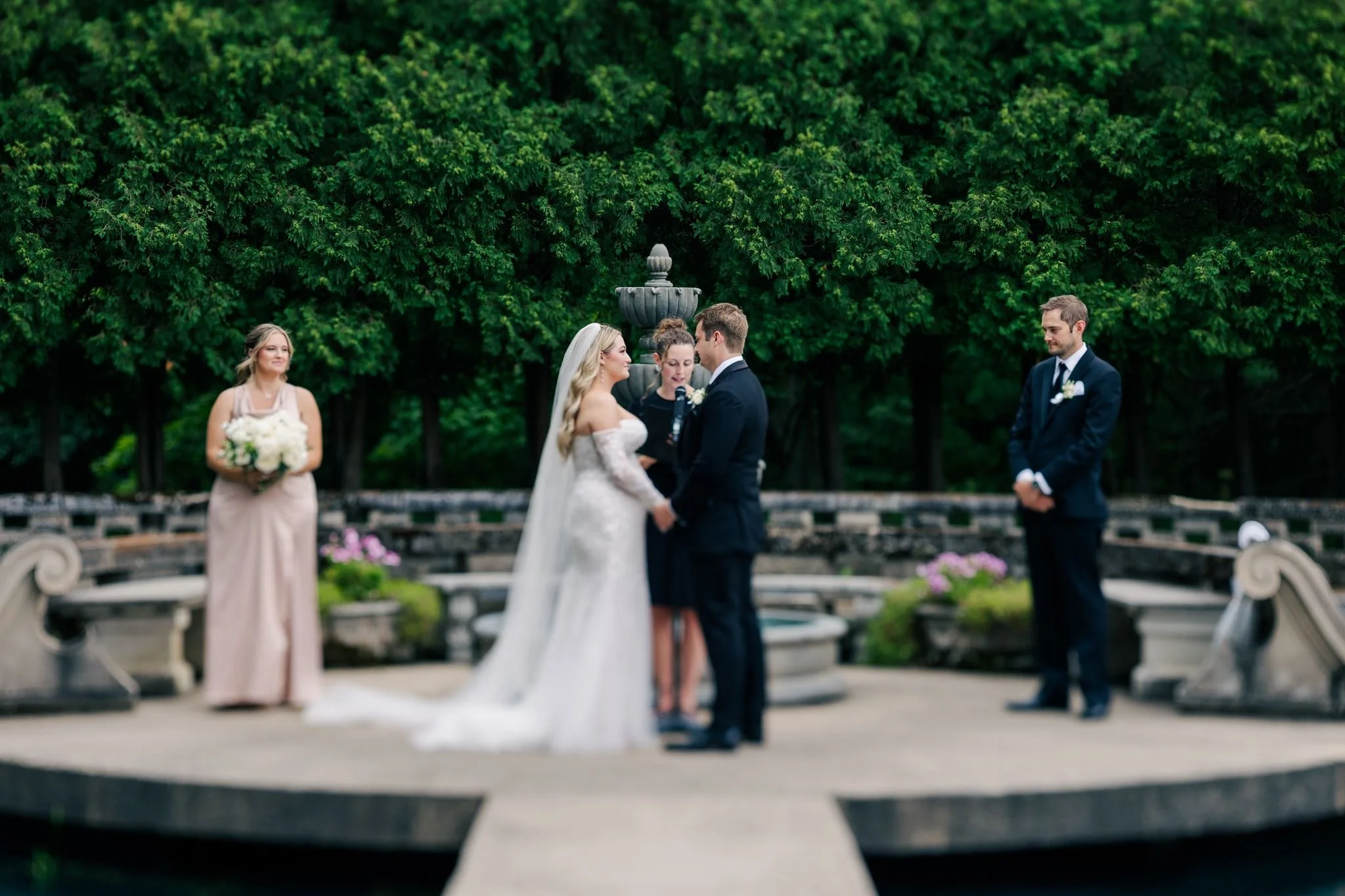 wedding-ceremony-in-front-of-fountains-at-felt-mansion.jpg