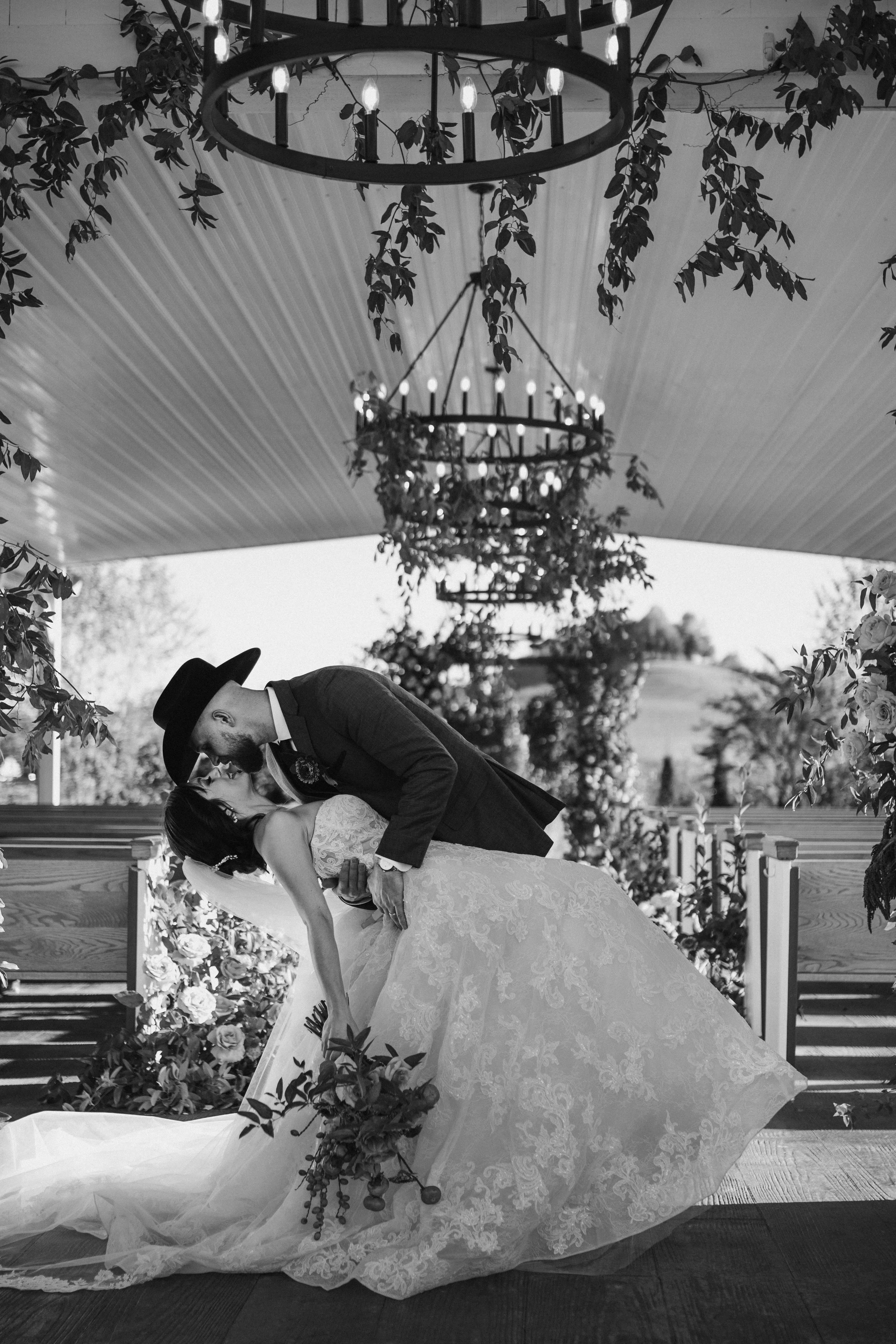 Alabama wedding photographer capturing black and white photo of western bride and groom