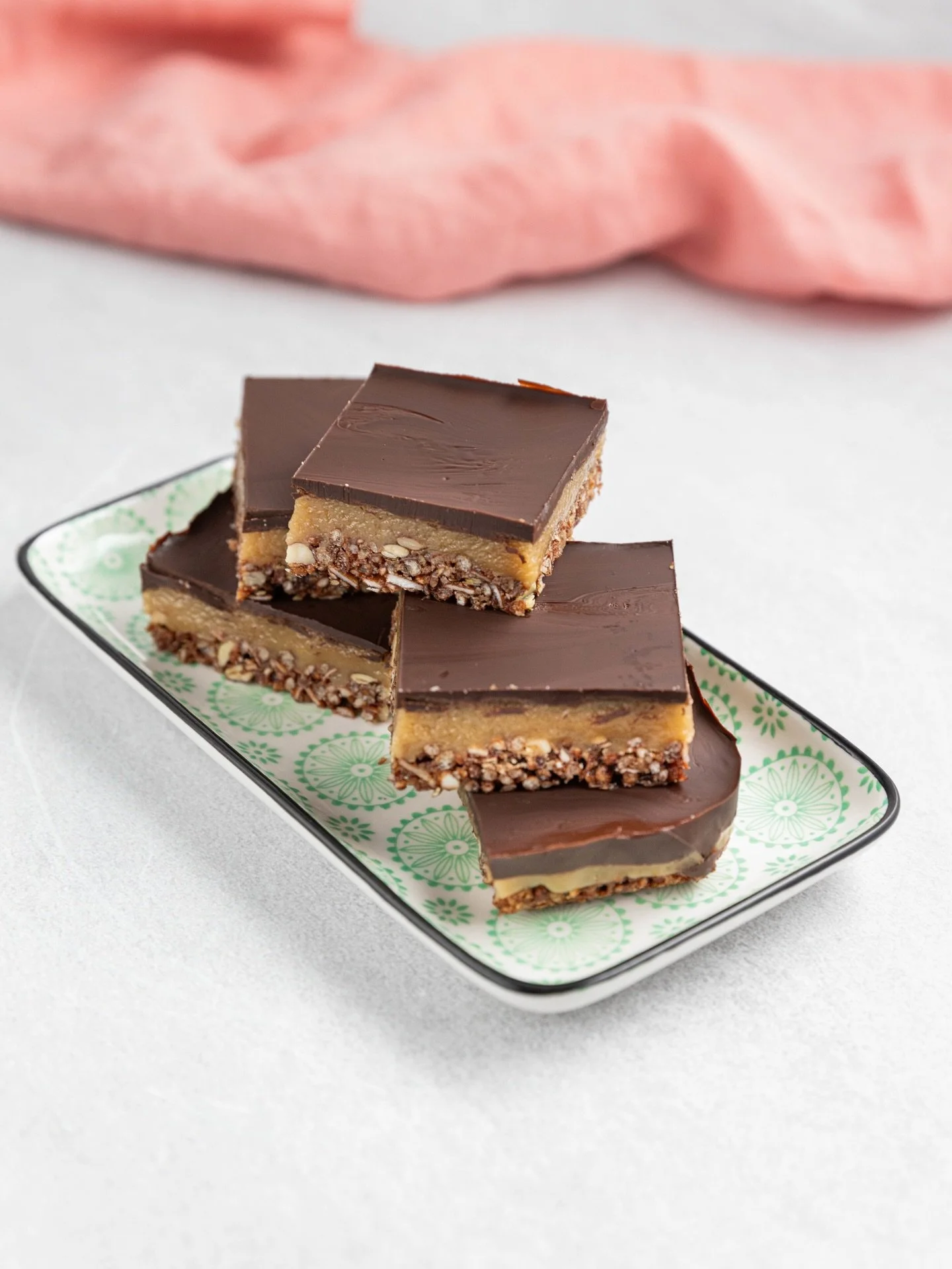 Caramel Tahini Slice

Ingredients
Base:
2 cups low sugar granola, roughly chopped (I used Brookfarm GF - great for GF option)
1/4 cup almond flour
3 tbsp extra virgin olive oil
2 tbsp honey 

Caramel layer:
1/2 cup tahini
1/4 cup honey
2 tbsp extra v