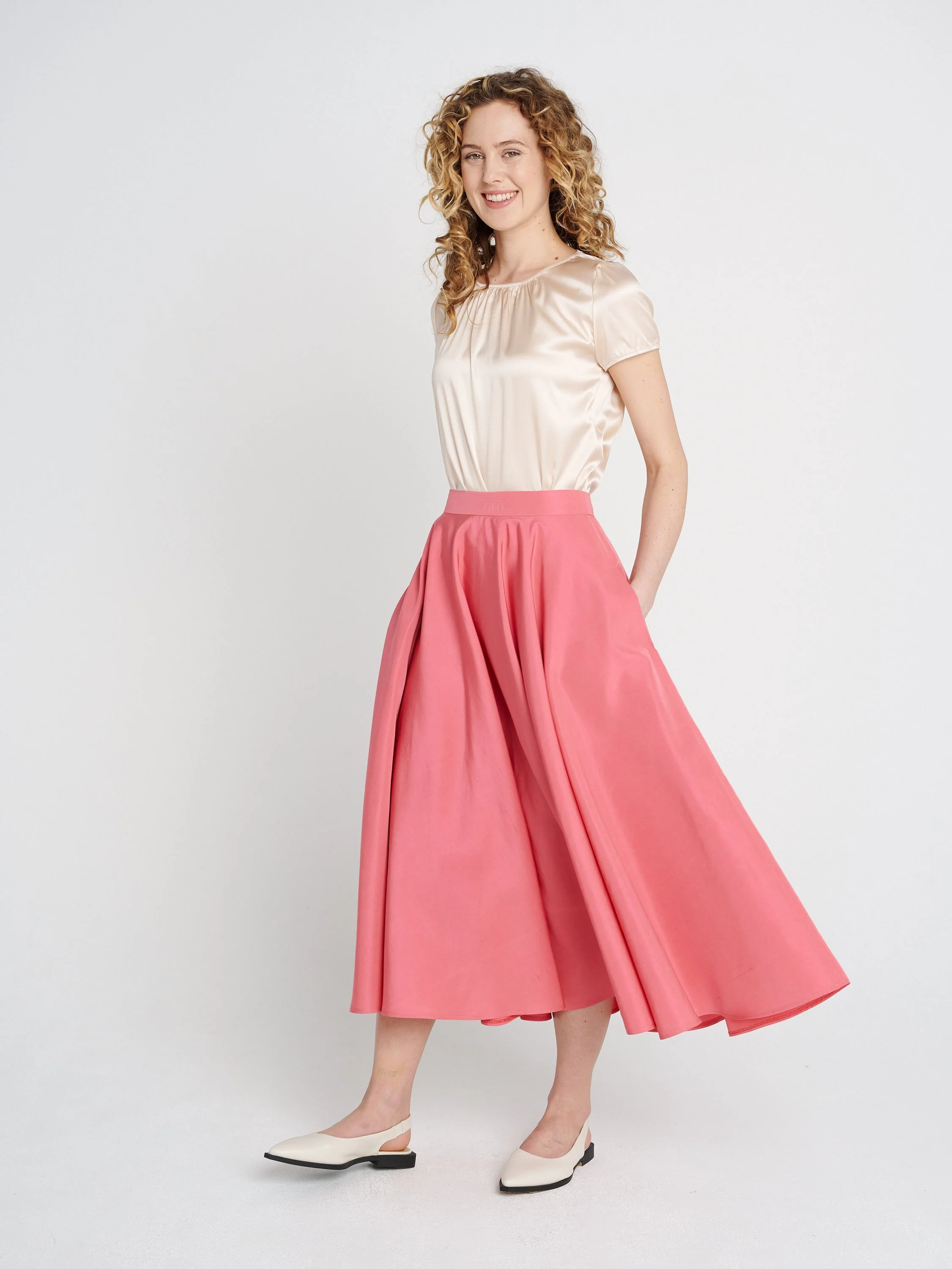 Weich fallender Rock für Hochzeitsgäste oder Anlässe mit Taschen und Bündchen, midi.