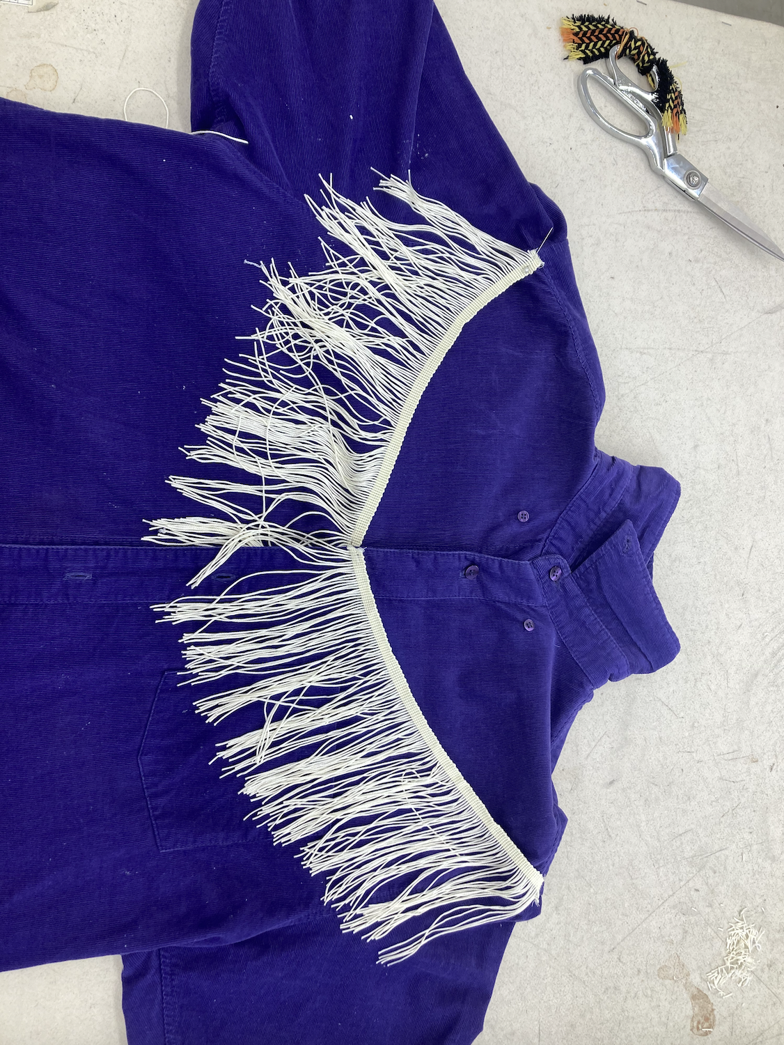 Adding fringe to the shirt