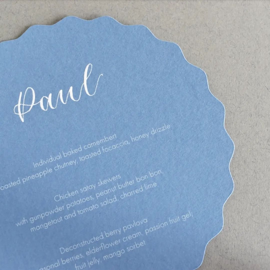 Personalised menus are a really stylish touch to table settings, allowing guests to see their own choices in their setting and duplicating as a placecard.

These are a fun, contemporary version die cut into a wavy circle and printed on premium Colorp