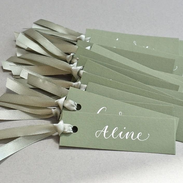 Sage Green = a colour trend that isn't going anywhere. These placecards are made up of a premium Colorplan cardstock in Mid-Green, a beautiful sage green satin ribbon embellishment and white ink calligraphy. 

These will shortly be available in my on