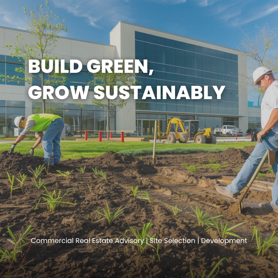 Construction workers planting new green plants in landscaping area outside modern office building with large glass windows, blue sky, and trees.