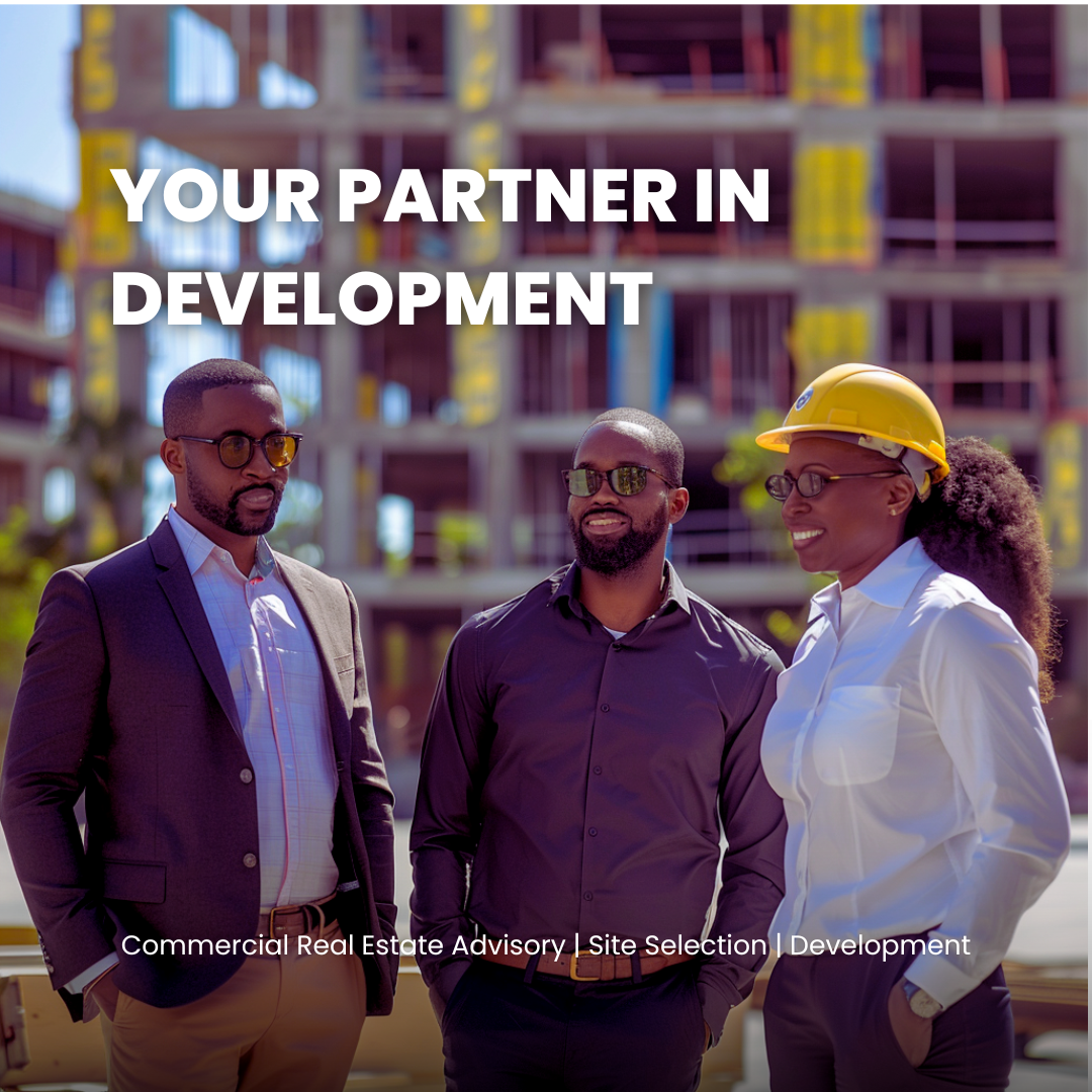 Three professionals, two men and one woman, stand outside a construction site at a building under development. The woman wears a yellow hard hat and white shirt, and the men wear sunglasses and business attire. They are smiling and appear to be discu