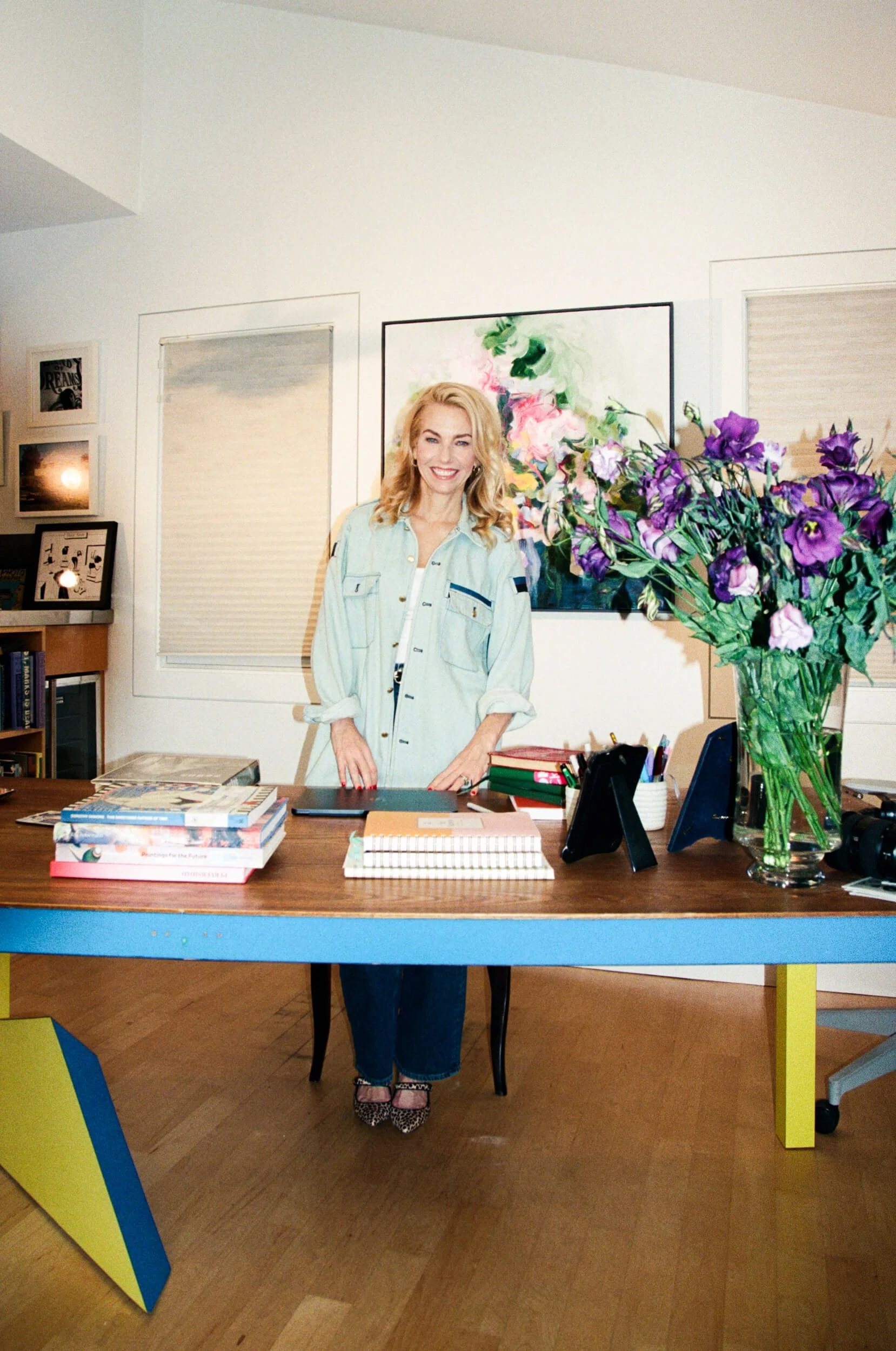 amie steir author and director standing at desk working from home
