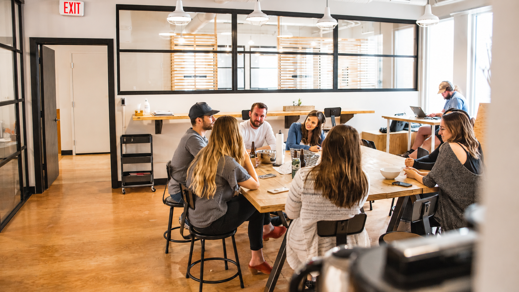 Group of employees talking to an LXD