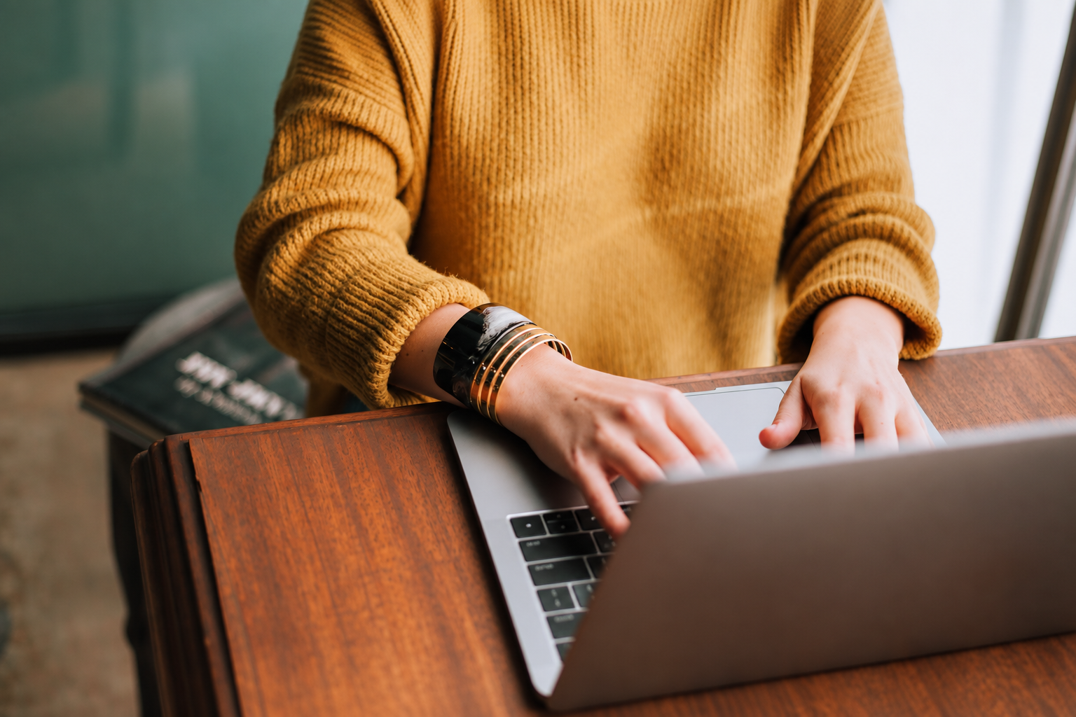 Person sitting at a desk working on a computer.