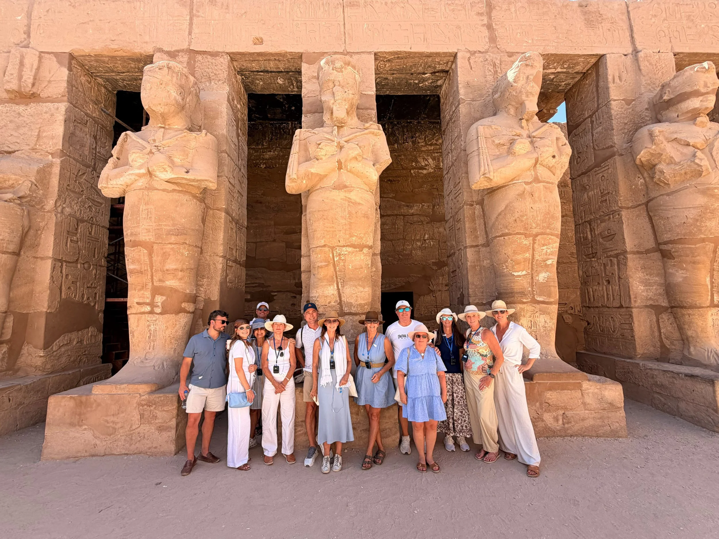 Standing among towering columns at Karnak Temple in Luxor, Egypt