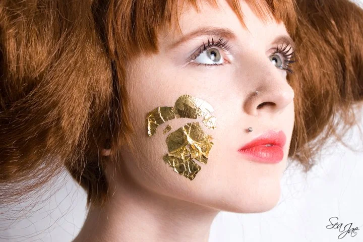 beautiful redhead woman gold foil heart messy  hair