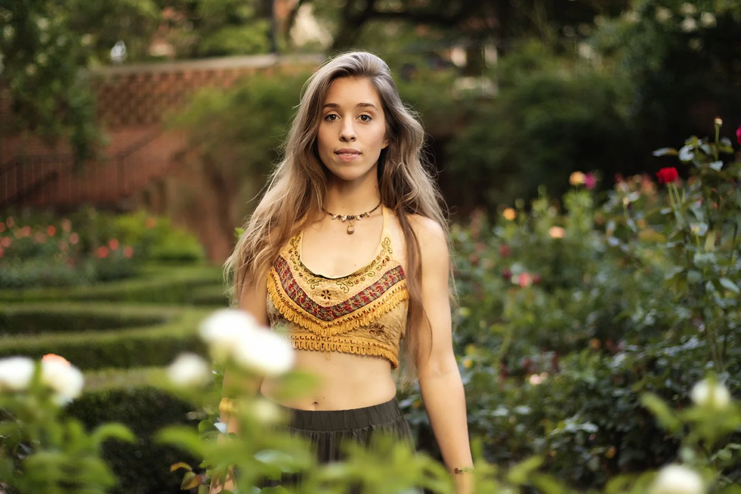 Beautiful blond in a rose garden