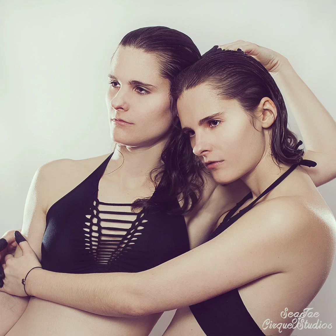 brunette twins two sisters hugging