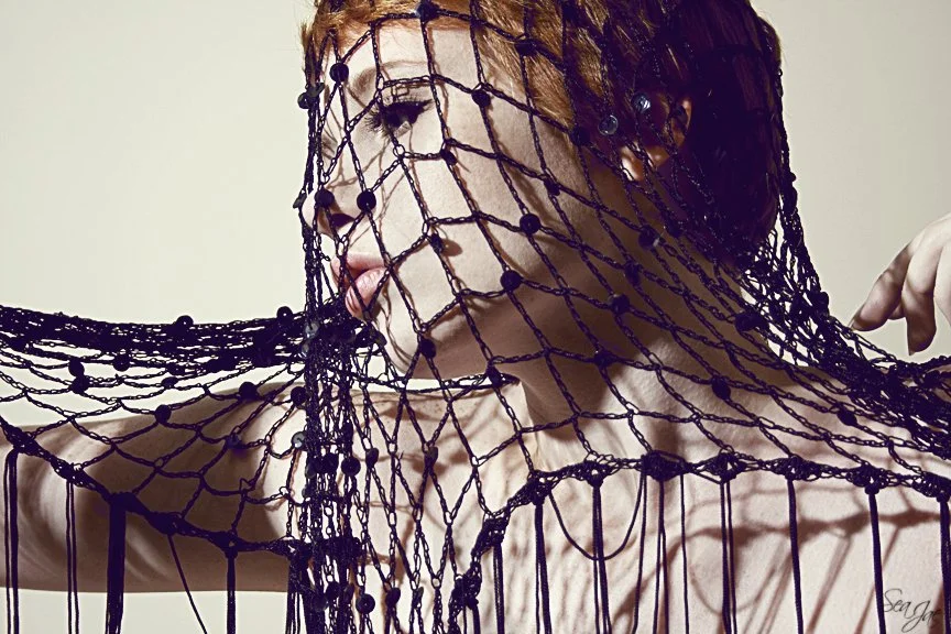 short hair red head woman jawline netting