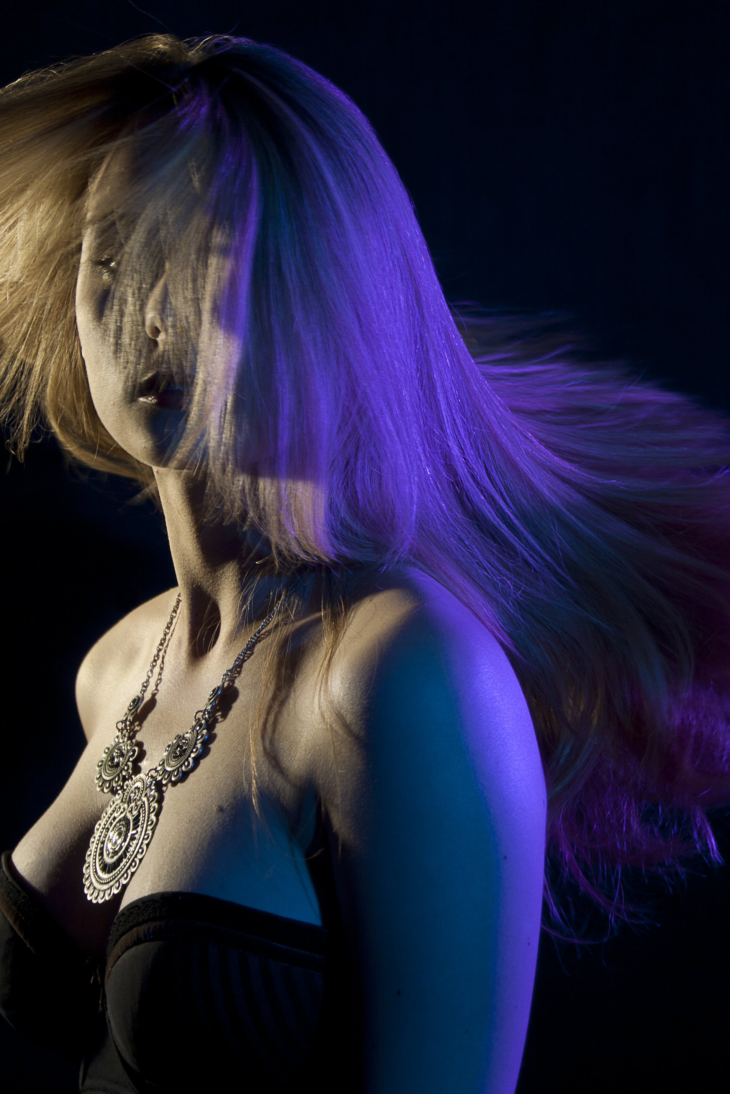 woman in light and purple shadows