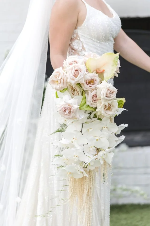 Cascading bridal bouquet with orchids and roses foe an elegant luxury wedding. New Jersey Florist.