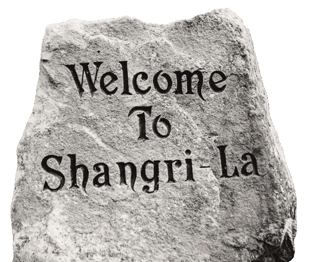 Stone carving that says "Welcome to Shangri-La"