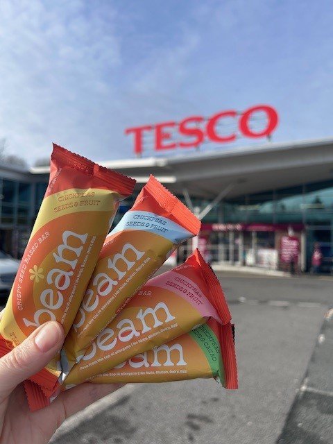 Shauna Blair holding Beam Bars in front of Tesco