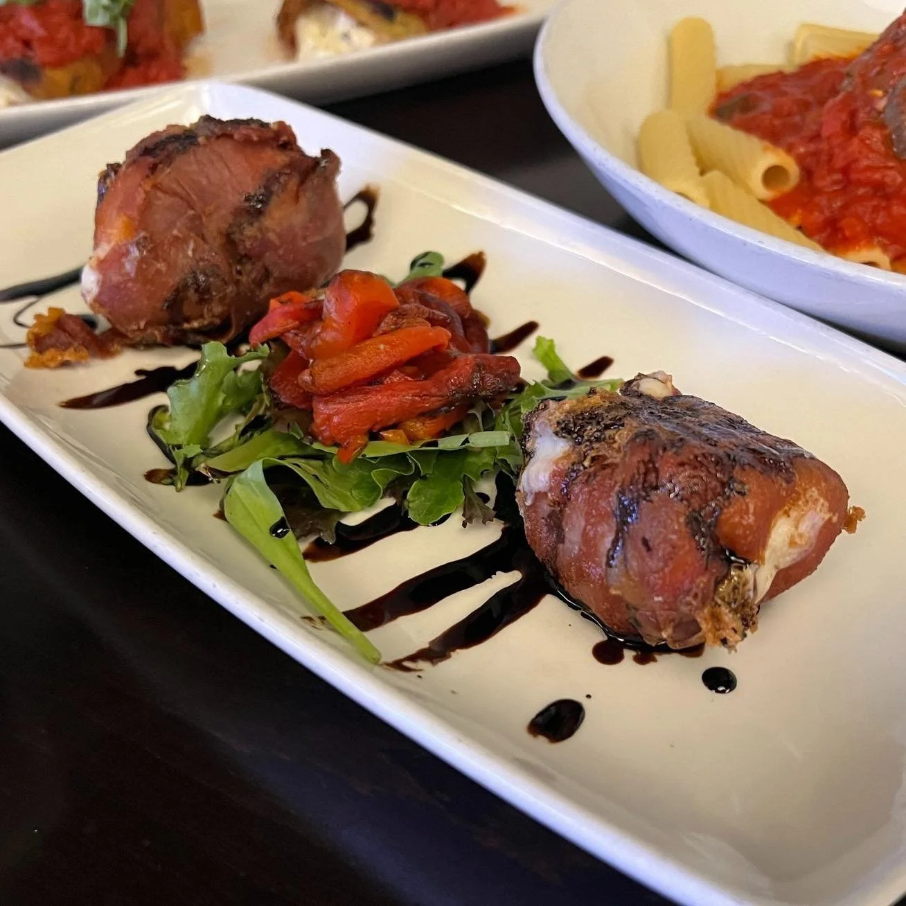 Warm, rich, and made to be shared.

Our Baked Fresh Mozzarella comes out soft and bubbling, layered with prosciutto, drizzled with extra virgin olive oil, and finished with a balsamic reduction and fresh basil. It&rsquo;s creamy, savory, and just ind