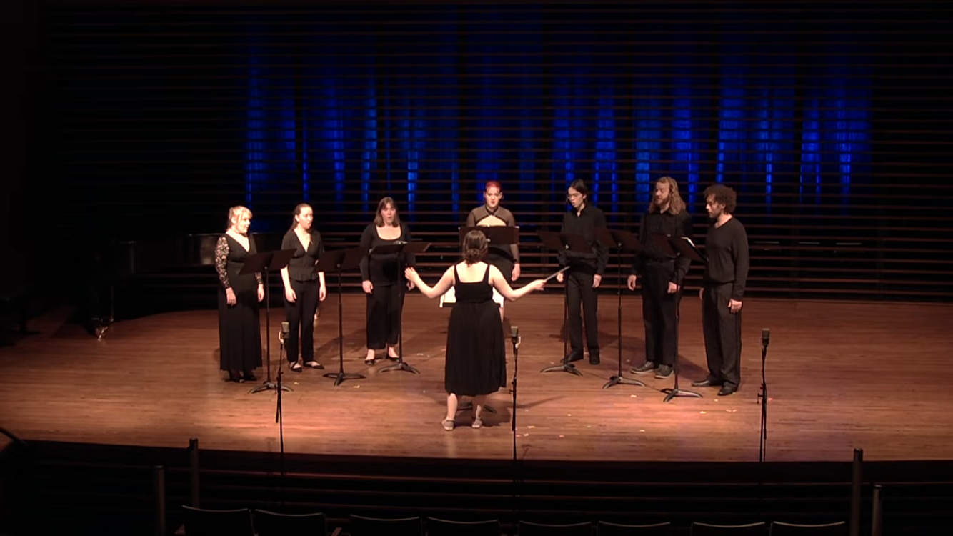 Corrao conducting "Haunted Seas" (2025) as the final piece on her senior full recital