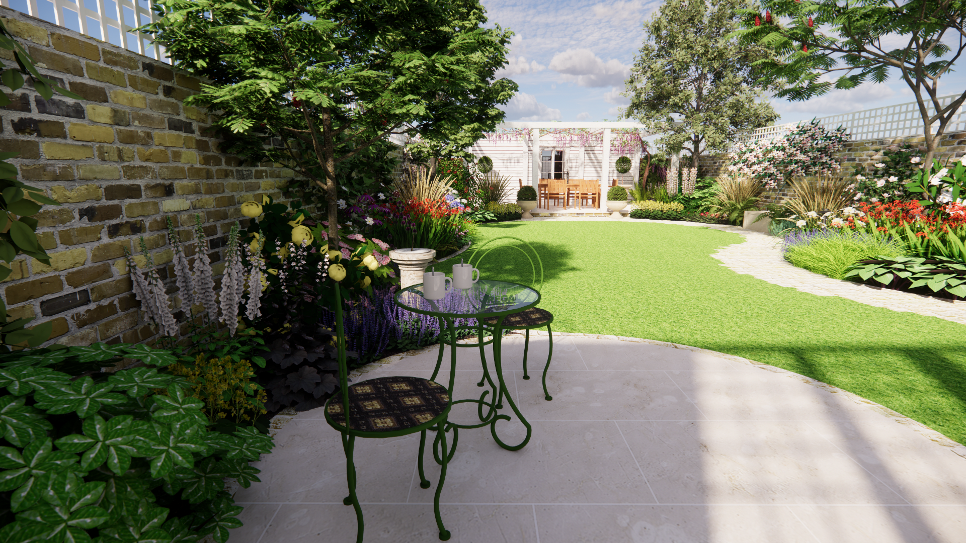 A backyard garden with a brick wall, green trees, colorful flowers, a green lawn, and a patio with a glass table, two chairs, and two white coffee mugs. There is a white garden shed or house with a porch and a table with chairs in the background under a cloudy sky.