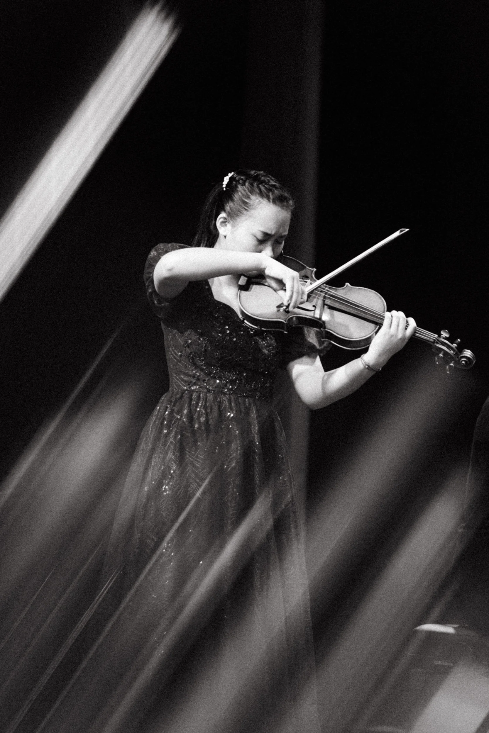Photo of a participant in a music masterclass and competition.