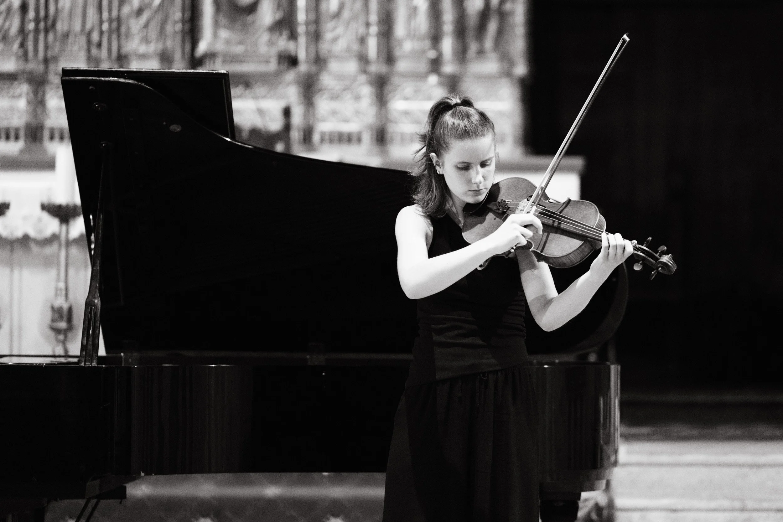 Concert photography for music festivals - a violinist playing in a student concert.