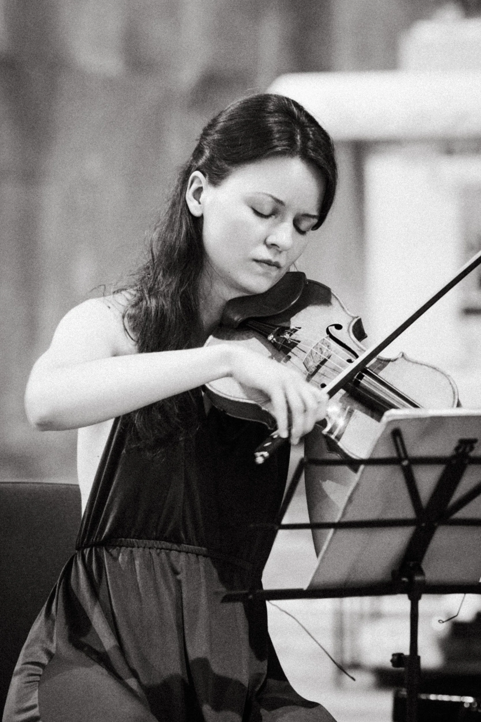 Close up portrait of a student musician during a masterclass concert.