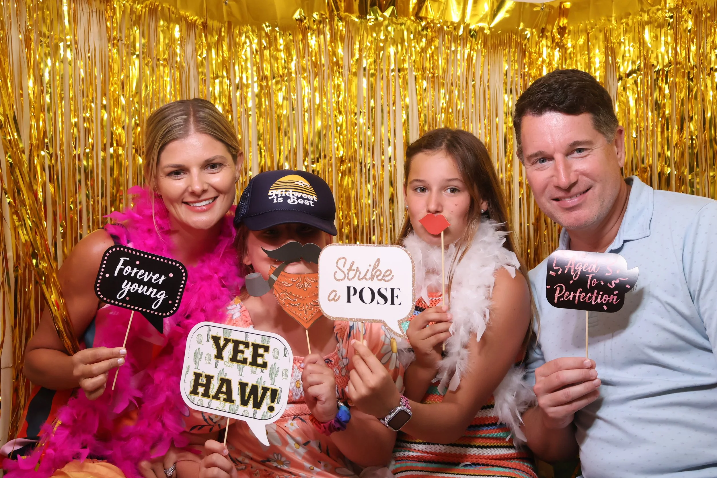 Family having fun in a Photo Booth rental