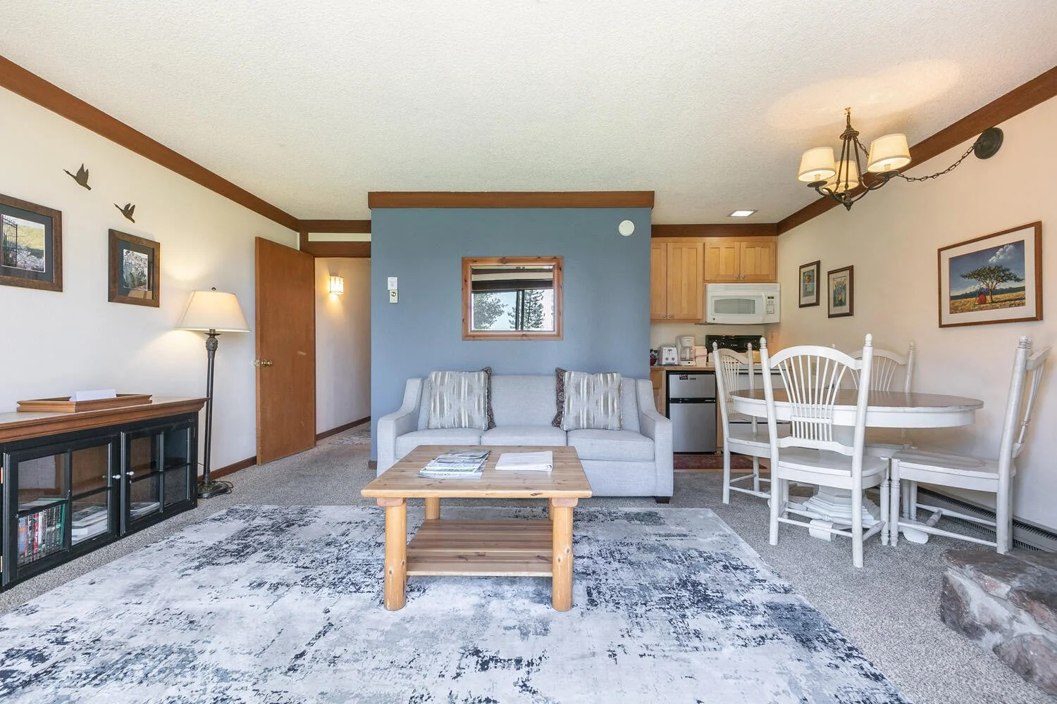 unit 2 living room also showing dining table