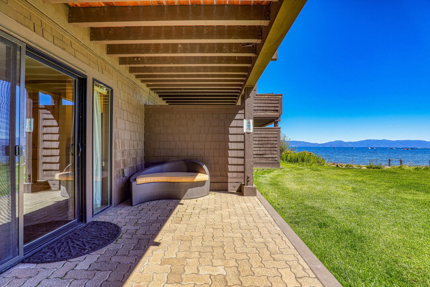 unit 45 lower deck with lounge chair looking out onto lake