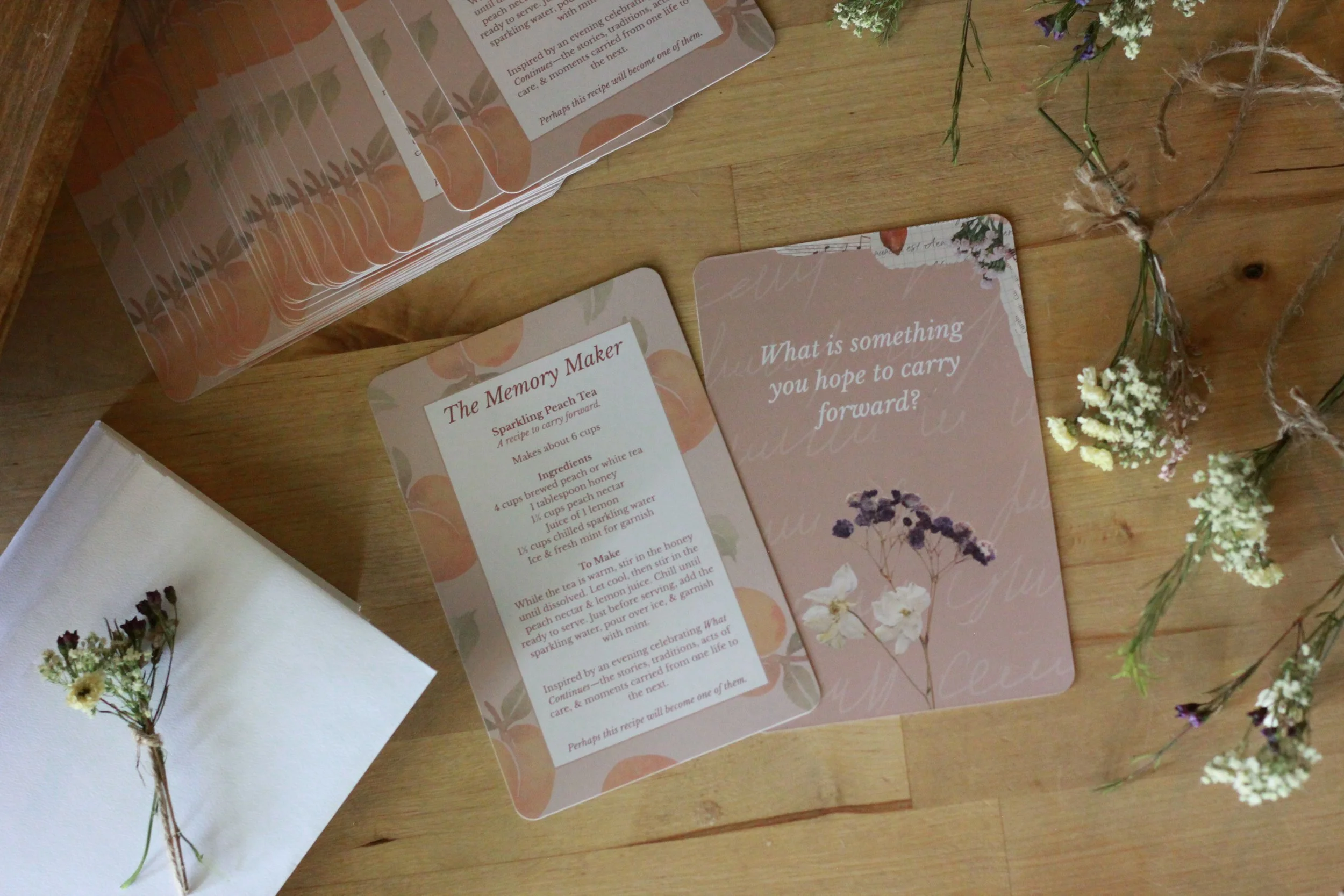 A custom-designed keepsake created for guests to carry the story of the gathering home. Professionally printed details, thoughtful prompts, and a preserved botanical element transformed a small paper piece into a meaningful part of the experience.