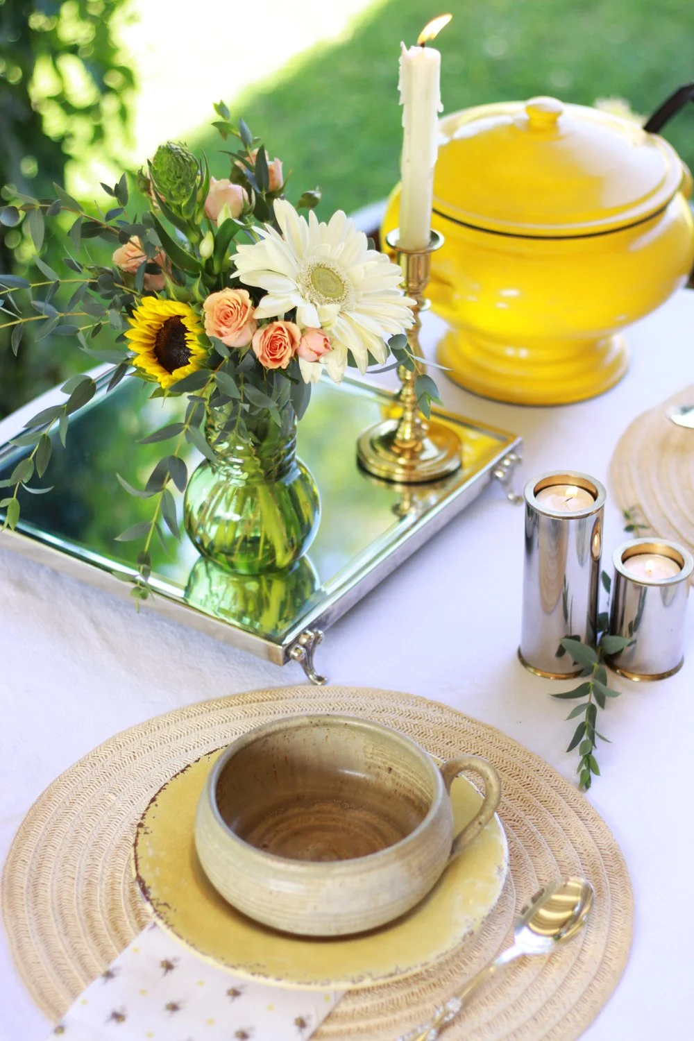 Vintage vessels, seasonal flowers, and carefully chosen details create a layered atmosphere for an intimate gathering.