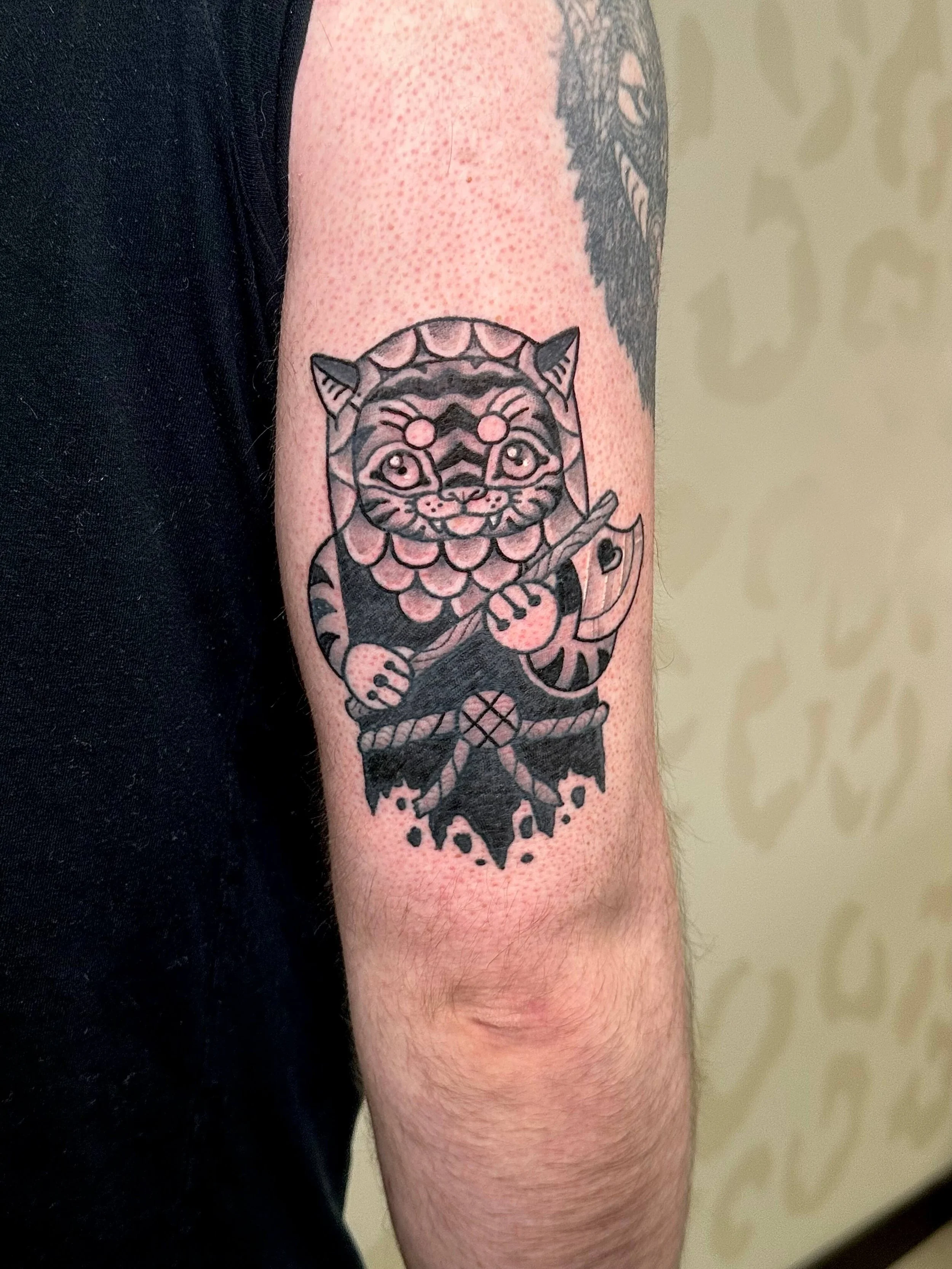 healed-medieval-cat-axe-tattoo.jpg