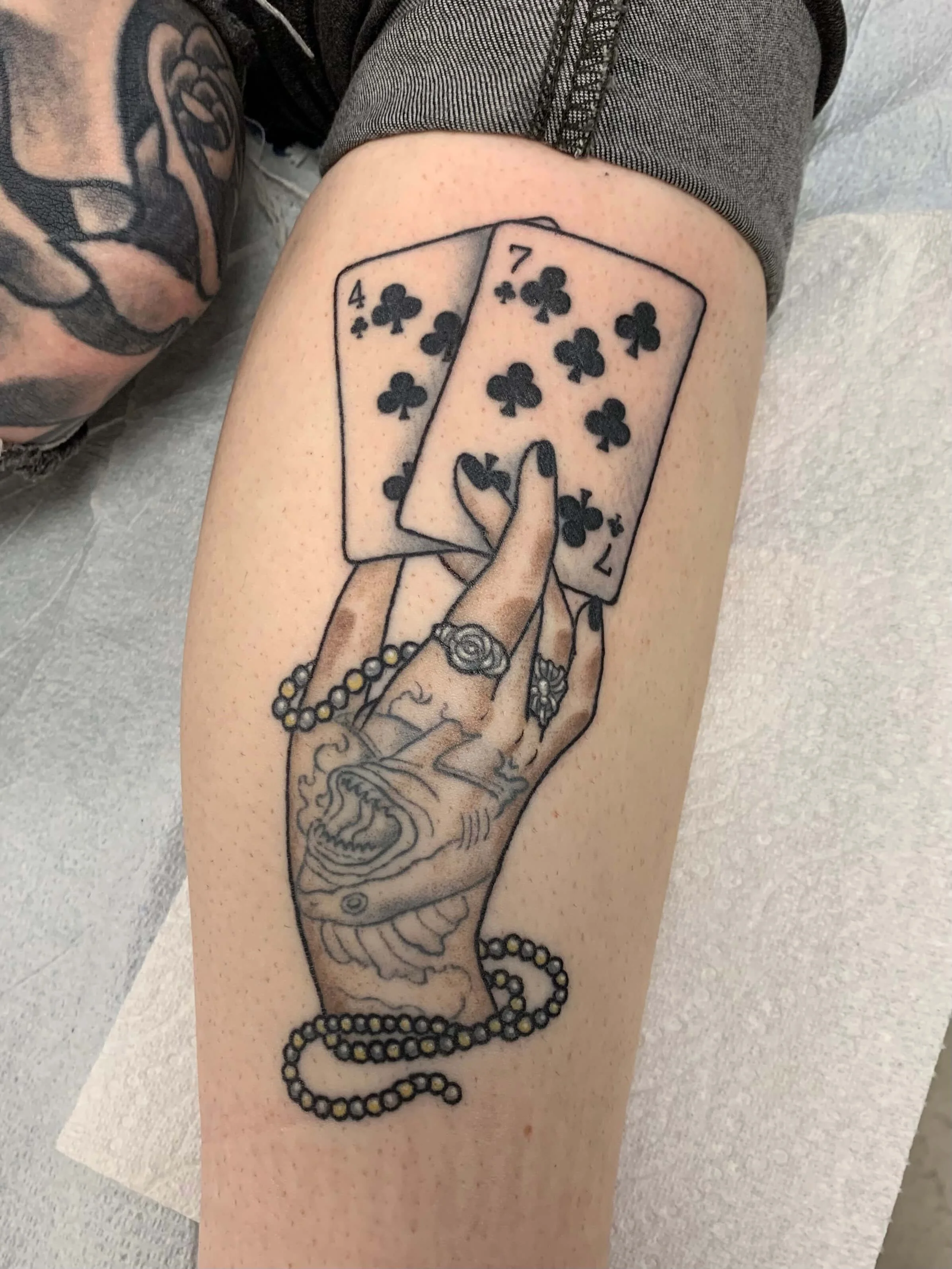 healed-and-holding-cards-tattoo.jpg
