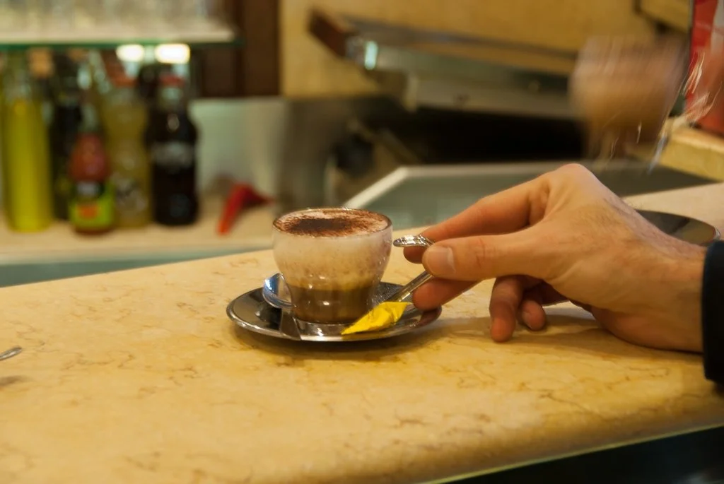 Rome Cappuccino with Cocoa at Bar GB's Hand Close Up.jpg
