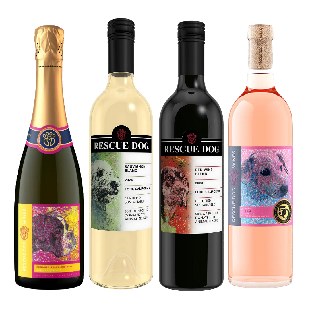 Four bottles of Rescue Dog wine, with labels featuring colorful dog illustrations, arranged in a row on a plain background.