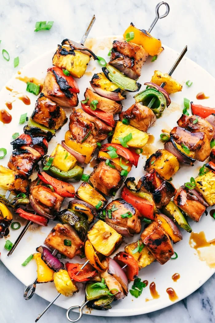 BBQ (barbeque) chicken and vegetable skewers with a pineapple glaze.