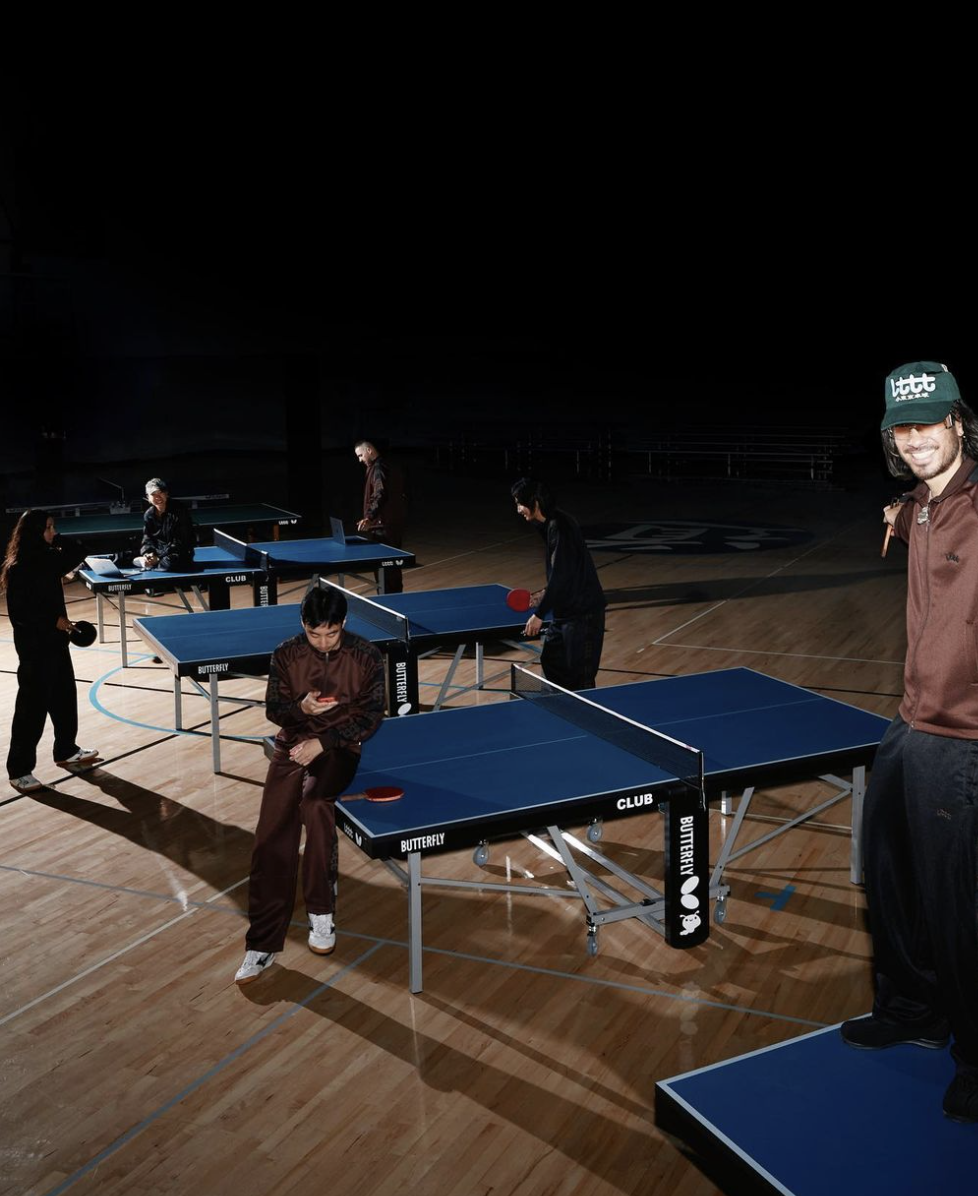 People around table tennis tables